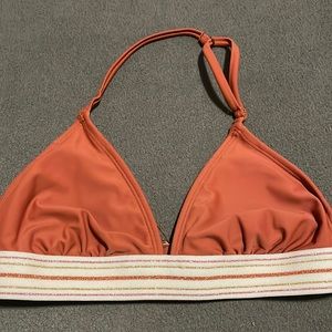 Gold, pink, yellow, and brownish, red, swim top.